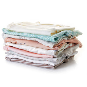 pile of folded baby clothes