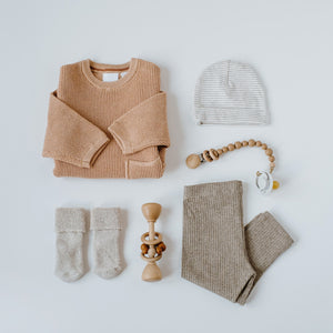 neutral coloured knitted baby clothes